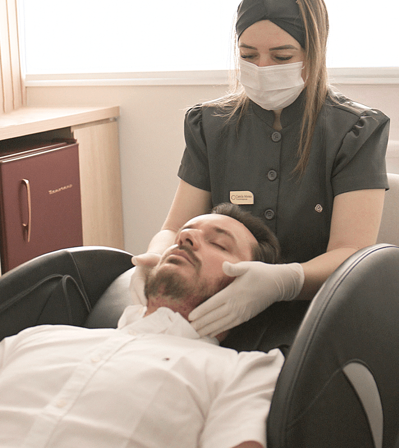 Post-surgery facial massage for hair transplant patient at Sanabria Clinic