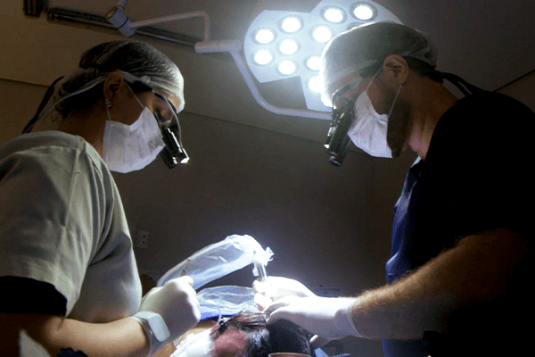 Sanabria Clinic surgical team performing hair transplant procedure